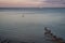 Scenic drone shot of a a ship on the sea on the Isle of Wight at sunset