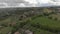 Scenic drone view of the Italian countryside above green meadows and  woods