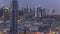 Scenic Dubai downtown skyline day to night timelapse. Rooftop view of Sheikh Zayed road with numerous illuminated towers