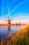 Scenic dutch rural landscape with traditional mill, spring in Netherlands