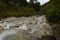 Scenic flowing river in the countryside of Dolomite