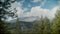 Scenic footage of mount Rainier surrounded by dense forests under the clouds