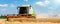 Scenic front view Big powerful industrial combine harvester machine reaping golden ripe wheat cereal field on bright
