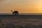 Scenic golden sunset at Areia Branca Beach in Lourinha, Portugal