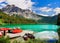 Scenic green lake boats mountains landscape