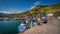 Scenic harbor view with multiple boats docked in the water in Mochiko, Portugal