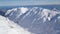 Scenic Helicopter ride over the Franz Josef Glacier and Fox Glacier with deep crevasses and snow during winter in New Zealand.