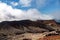 Scenic high angle view on Aso town, walk way from crater of active volcano Aso, mountains and abandoned old cable car building