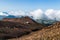 Scenic high angle view on Aso town, walk way from crater of active volcano Aso, mountains and abandoned old cable car building