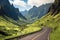 scenic highway with winding road and towering peaks in the background