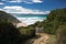 Scenic hike on coastal footpath with view on mountain jaizkibel in bidart, basque country, france