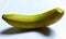 Scenic image of ripe banana with shadow  on white background.