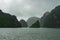 Scenic karst islands of Halong Bay on mist