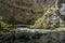 Scenic karst landscape and stone bridge near Zelske cave in national park Rakov Skocjan in Slovenia