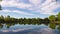 Scenic Lake with Cloud Reflections Zoom In Timelapse