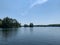 Scenic lakeside with greenery under the blue sky