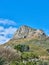 Scenic landscape of blue sky over the peak of Table Mountain in Cape Town on a sunny day from below. Beautiful views of