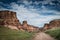 Scenic landscape inside canyon with long country road. Rocks on sides