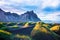 Scenic landscape with most beautiful mountains Vestrahorn on the Stokksnes peninsula and cozy lagoon with green grass on the sand