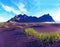 Scenic landscape with most breathtaking mountains Vestrahorn on the Stokksnes peninsula and cozy lagoon with green grass on the