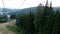 Scenic landscape in the mountains. Riding down the hill in a cable car. Blue ski lift or elevator used as a viewpoint during