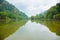 Scenic landscape and perspective view of rainforest national park shows beautiful greeny lake and cloud with water reflection