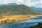 Scenic landscape of Ramganga River and mountains and cloudy sky at dhikala zone of corbett national park or tiger reserve