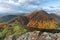 Scenic landscape in Sulov, Slovakia, on beautiful autumn sunrise with colorful leaves on trees in forest and bizarre pointy rocks