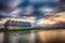 Scenic landscape view of a lake surrounded by a variety of brightly colored houses.