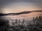 Scenic landscape with a view from a mounatin range to the valley filled with low clouds and fog during temperature inversion