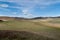 Scenic landscape of yaks eating Green grass against blue sky