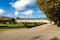 A scenic landscaped garden with cone-shaped plants near the Church of the Hotel des Invalides, Paris