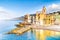 Scenic Mediterranean riviera coast. Panoramic view of Camogli town in Liguria, Italy. Basilica of Santa Maria Assunta and colorful