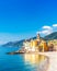 Scenic Mediterranean riviera coast. Panoramic view of Camogli town in Liguria, Italy. Basilica of Santa Maria Assunta and colorful