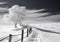 Scenic monochrome image of a fence in sand dunes. Snow scenes in minimalist style. Winter time. AI generative