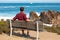 Scenic Monterey coast, travel man enjoying beautiful view of the Kissing Rock, Pacific Grove, Monterey, California, USA