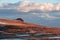 Scenic morning view after sunrise on summit cross of mountain peak Grosser Sauofen, Saualpe, Lavanttal Alps, Austria