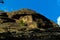 Scenic mountain landscape with great rock on hillside. Awesome alpine scenery with beautiful  crag on background of mountains