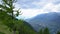 Scenic mountain landscape POV with clouds and sun rays at evening