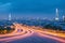 a scenic night cityscape light and speed line of traffic on a road bridge.