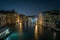 Scenic nighttime view of a beautiful Venetian canal with buildings