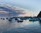 Scenic ocean, island sunrise, bay view of sailboats, yachts, fishing boats in Catalina Island harbor