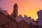 Scenic orange susnet and oldtown buildings in Locorotondo, region Puglia, Italy