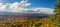 Scenic panorama of autumn forest in mountains