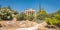 Scenic panorama of the green park with Ancient Greek ruins in Athens, Greece