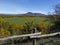 Scenic panorama of meadows and plateaus with green grass in mountainous terrain