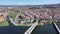 Scenic panorama of Mirandela cityscape on banks of Tua overlooking residential districts, two bridges across river and