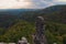 Scenic panorama with typical rocky peaks under thunderstorms clouds. Bohemian Switzerland National Park. Czech Republic