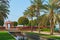 Scenic park view to marble arabesque gazebo,fountain surrounded palms in Emirates Palace,UAE