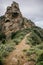 Scenic path leading to the summit of a majestic cliff in a verdant landscape, La Gomera, Spain